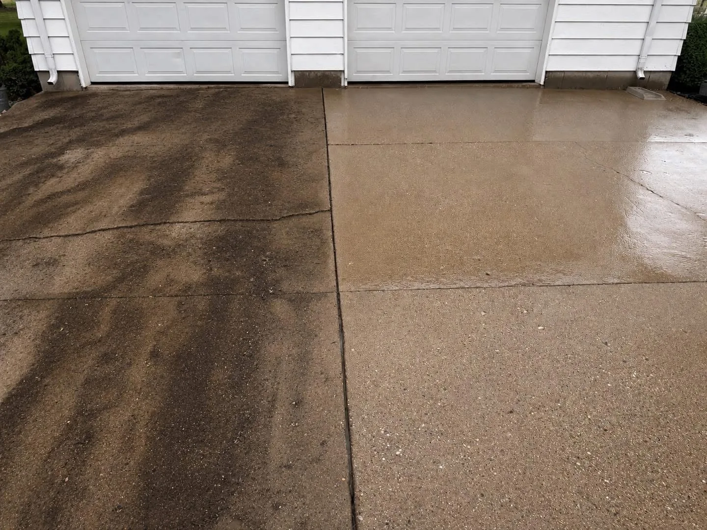 Before-and-after concrete driveway cleaning result by Rock River Home & RV